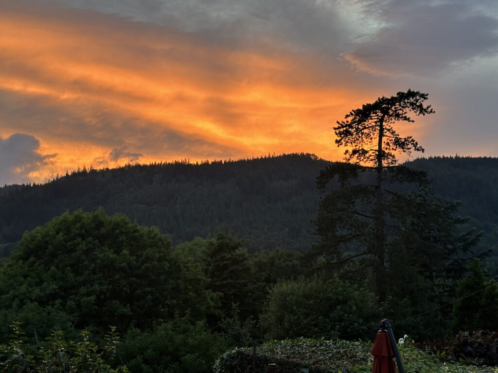 Sunset over the Conwy Valley seen from Bryn Bella's elevated garden in Betws-y-Coed